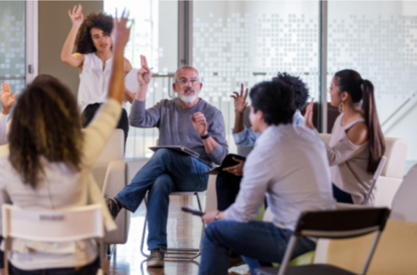 a group of people raising their hands